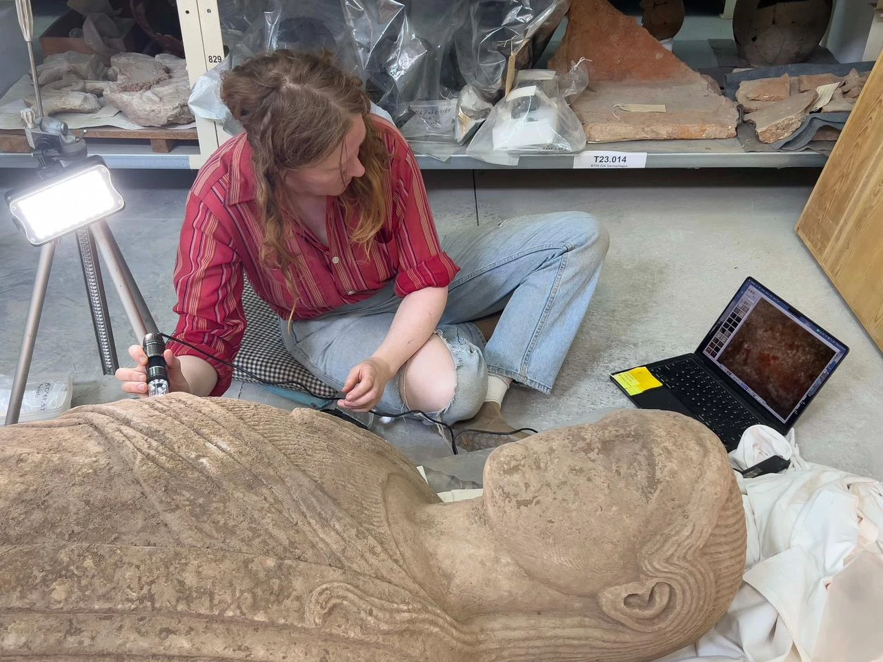 A conservation specialist uses imaging equipment to study the statue’s surface for surviving details and possible traces of ancient pigment. (AA Photo)