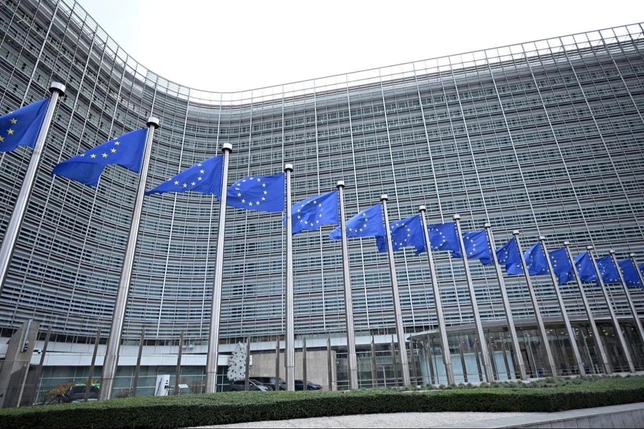 A view of the Berlaymont building and European Union flags in Brussels, Belgium, December 4, 2025. (AA Photo)