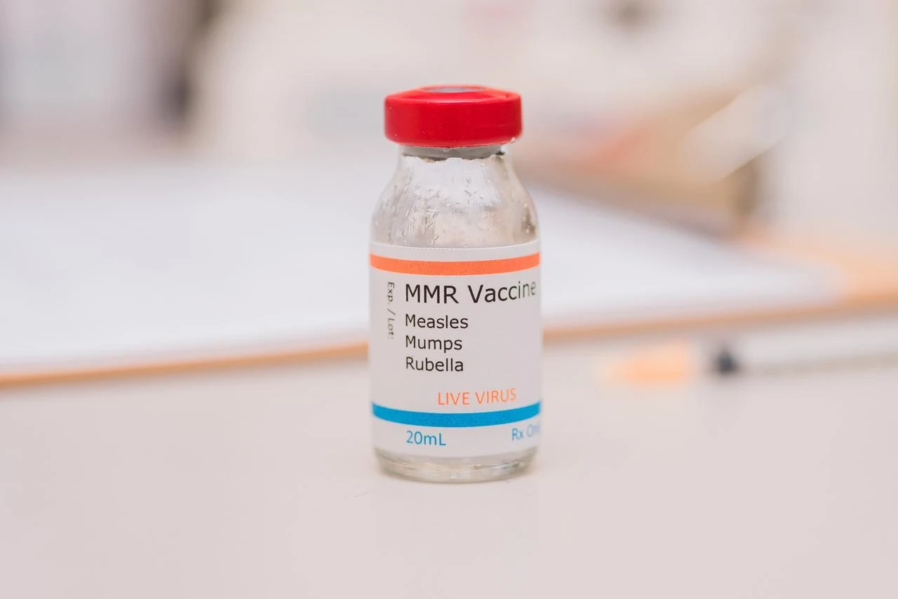 A vial labeled as an MMR vaccine for measles, mumps and rubella sits on a counter. (Envato Stock Photo)