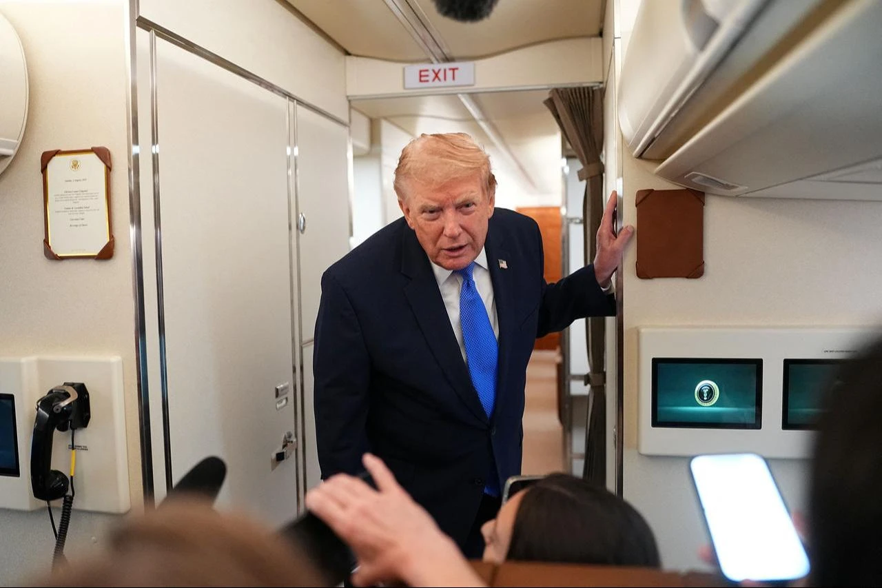 US President Donald Trump speaks to the press aboard Air Force One, August 2, 2026. (AFP Photo)