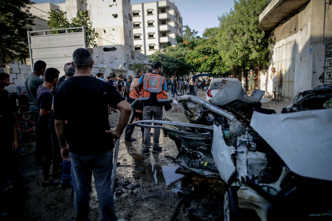 Palestinians inspect wrecked vehicle following the Israeli attack on a moving vehicle in the Al-Sabra neighborhood of Gaza City, Gaza, Palestine on August 2, 2026. (AA Photo)
