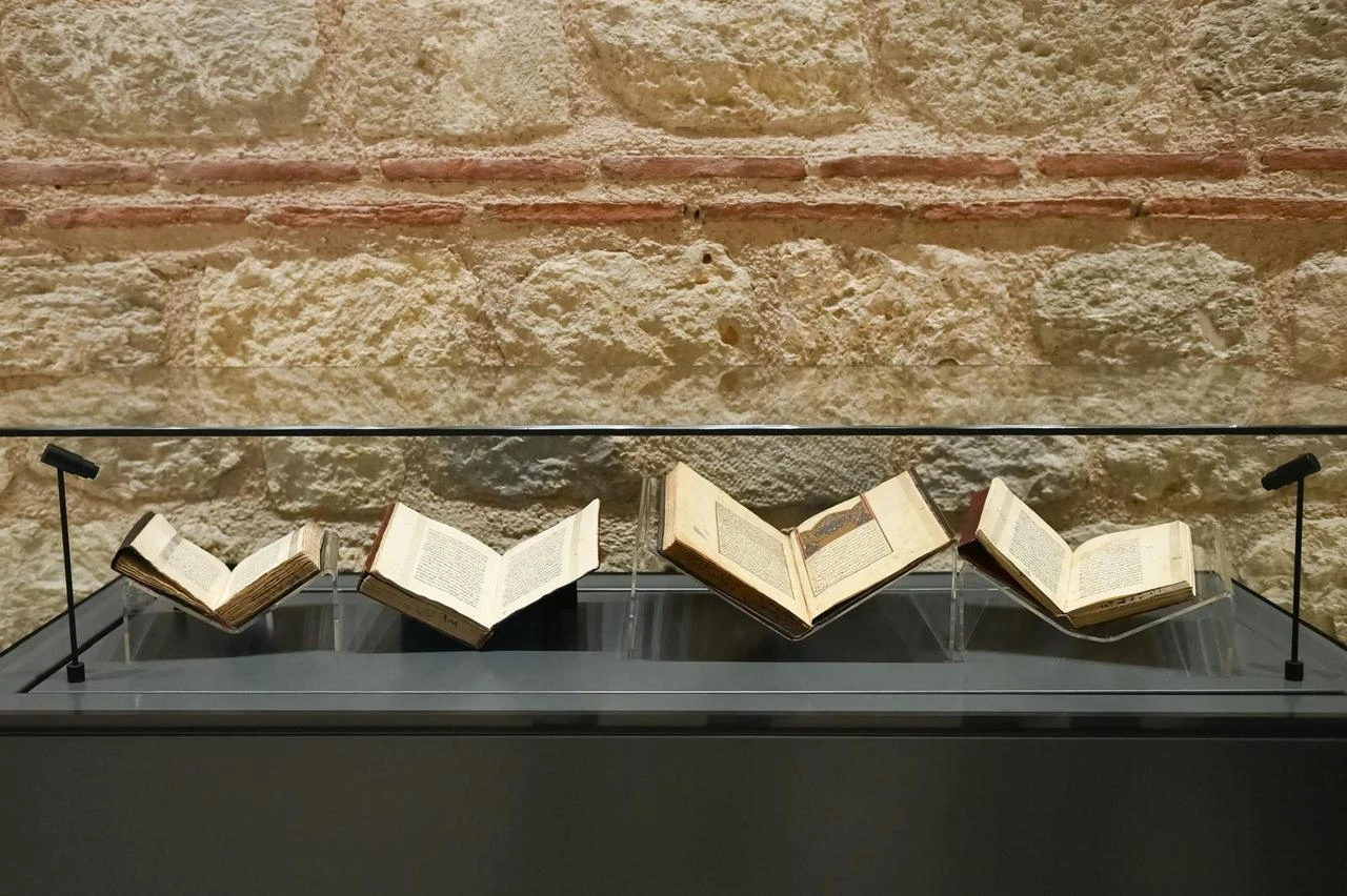 Manuscripts from the Türkiye Manuscript Institution’s collection are presented in a display case in Istanbul, Türkiye, Aug. 3, 2026. (AA Photo)