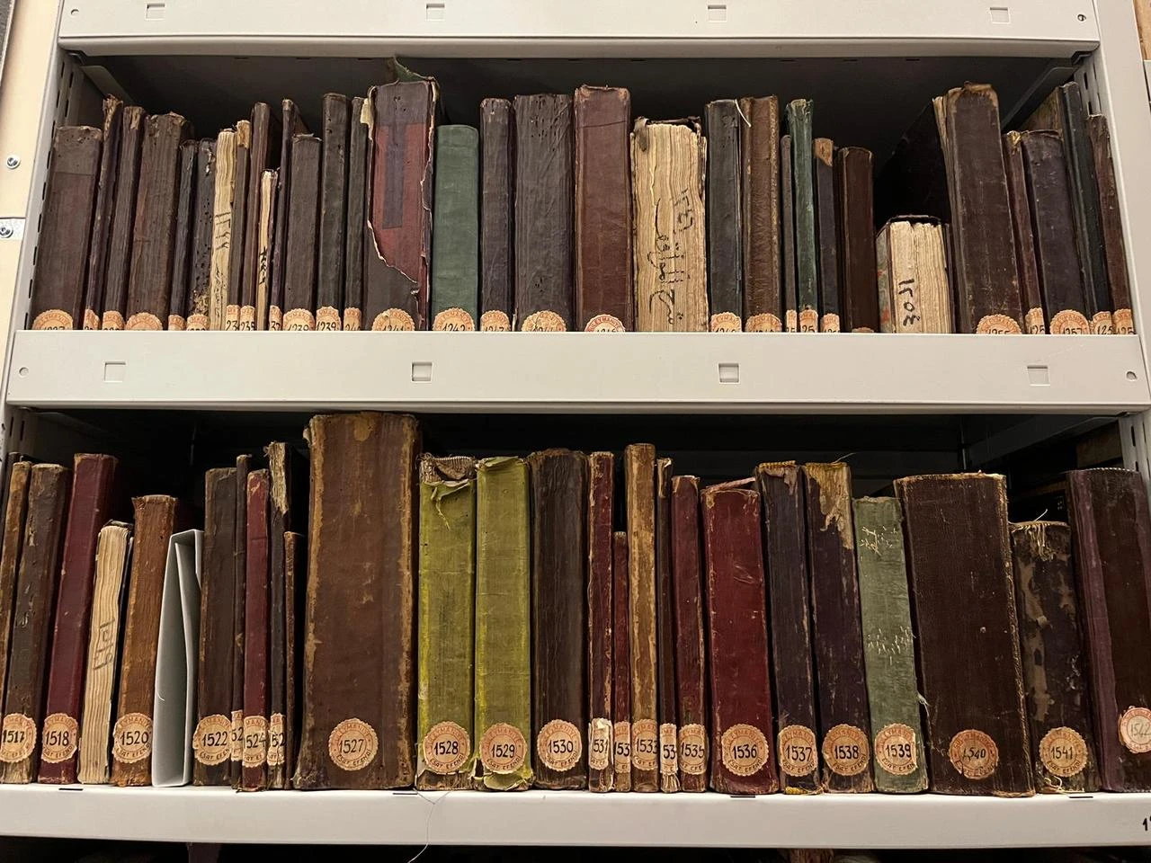 Historic manuscripts from the Türkiye Manuscript Institution’s collection are stored on archive shelves in Istanbul, Türkiye, Aug. 3, 2026. (AA Photo)