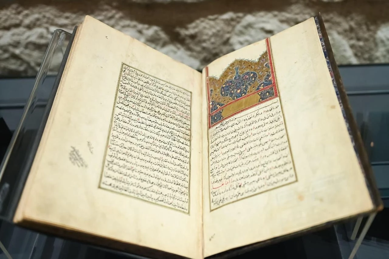 An illuminated manuscript is displayed as the Türkiye Manuscript Institution opens 6,388 digitized works to online access in Istanbul, Türkiye, Aug. 3, 2026. (AA Photo)