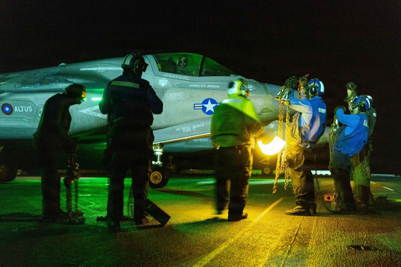 U.S. Sailors account for chocks and chains during flight operations in the U.S. Central Command area of responsibility, July 18, 2026. (Photo via U.S. Marine Corps)