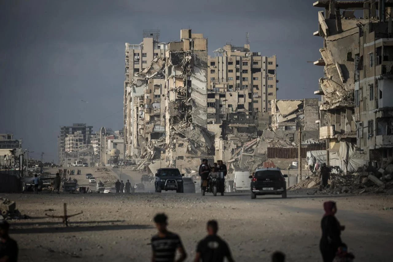 Palestinians walk along a road in Gaza City on July 3, 2026. (AFP Photo)