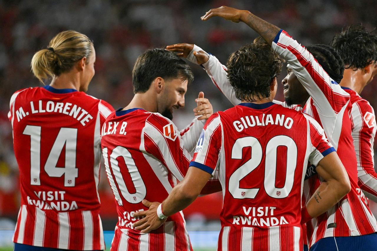 Atletico Madrid players, including Marcos Llorente, Alex Baena and Giuliano Simeone, celebrate during their La Liga match against Sevilla at Ramon Sanchez-Pizjuan Stadium in Seville, Spain, Aug. 29, 2026. (AFP Photo)