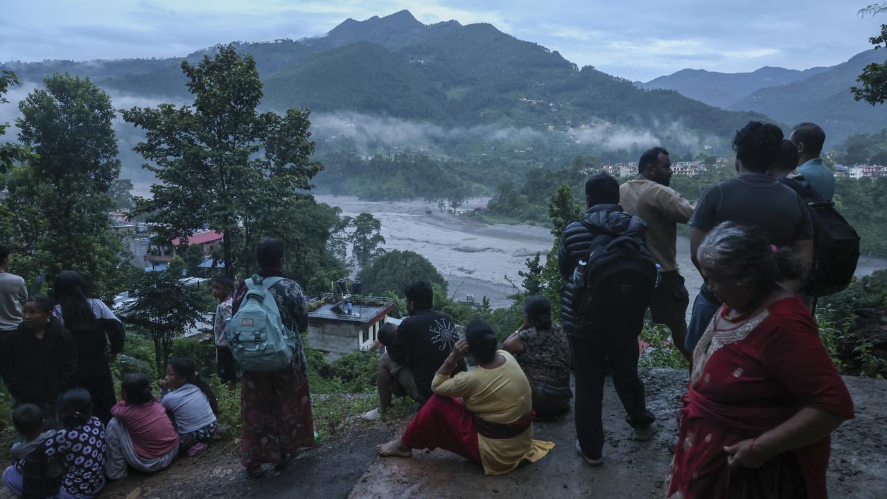 Photographs on phones and names on walls in Nepal's search for the missing