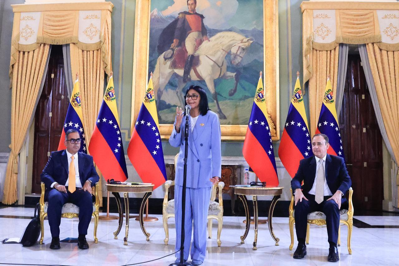 This handout picture released by the Venezuelan Presidency shows Venezuela's interim President Delcy Rodriguez (C) speaking in front of Rolando Alcala (R), Venezuela's minister of electric power, during a meeting at the Miraflores presidential palace in Caracas, June 15, 2026. (Photo via Venezuelan Presidency/HO/AFP)