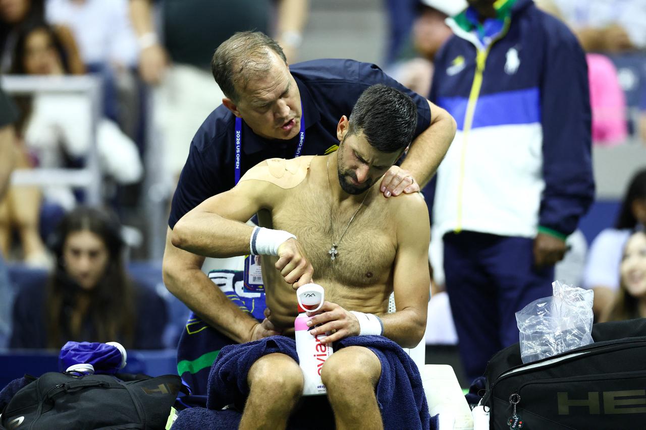 Djokovic receives treatment during his match against Navone on day one of the U.S. Open tennis tournament on August 30, 2026. (AFP Photo)