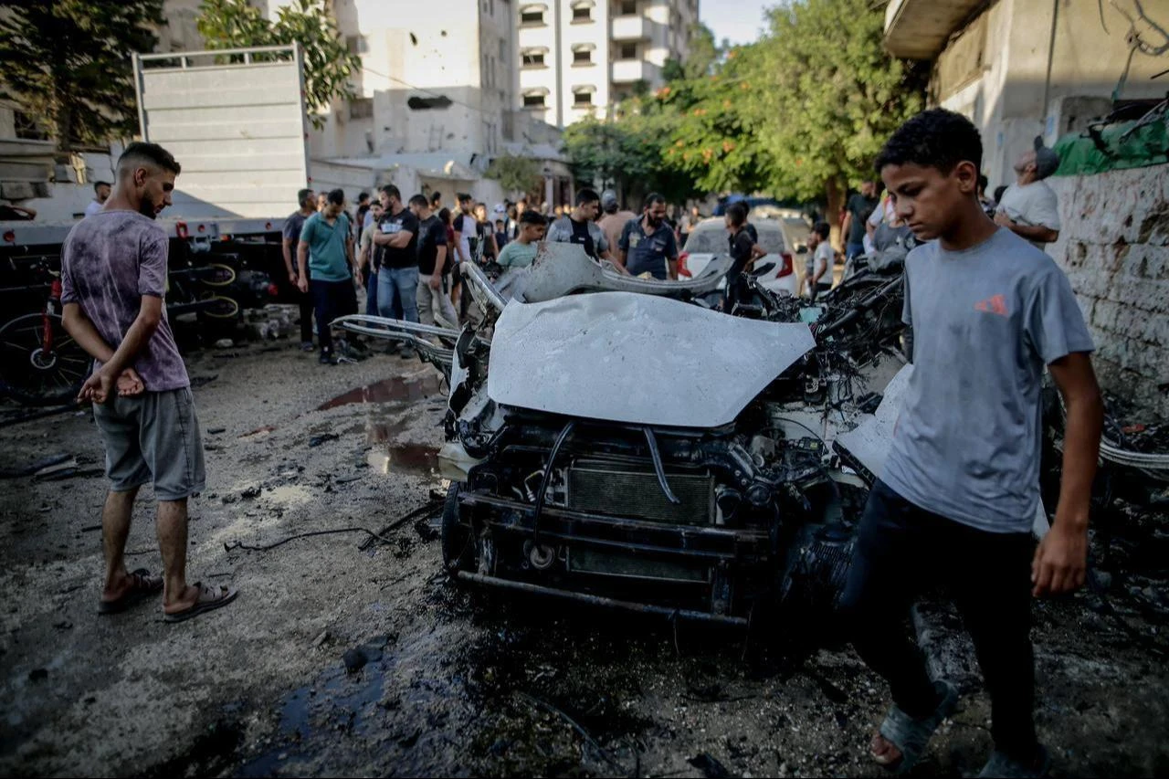 Palestinians inspect a wrecked vehicle following the Israeli attack on a moving vehicle in the Al-Sabra neighborhood of Gaza City, Gaza, Palestine, August 2, 2026. (AA Photo)