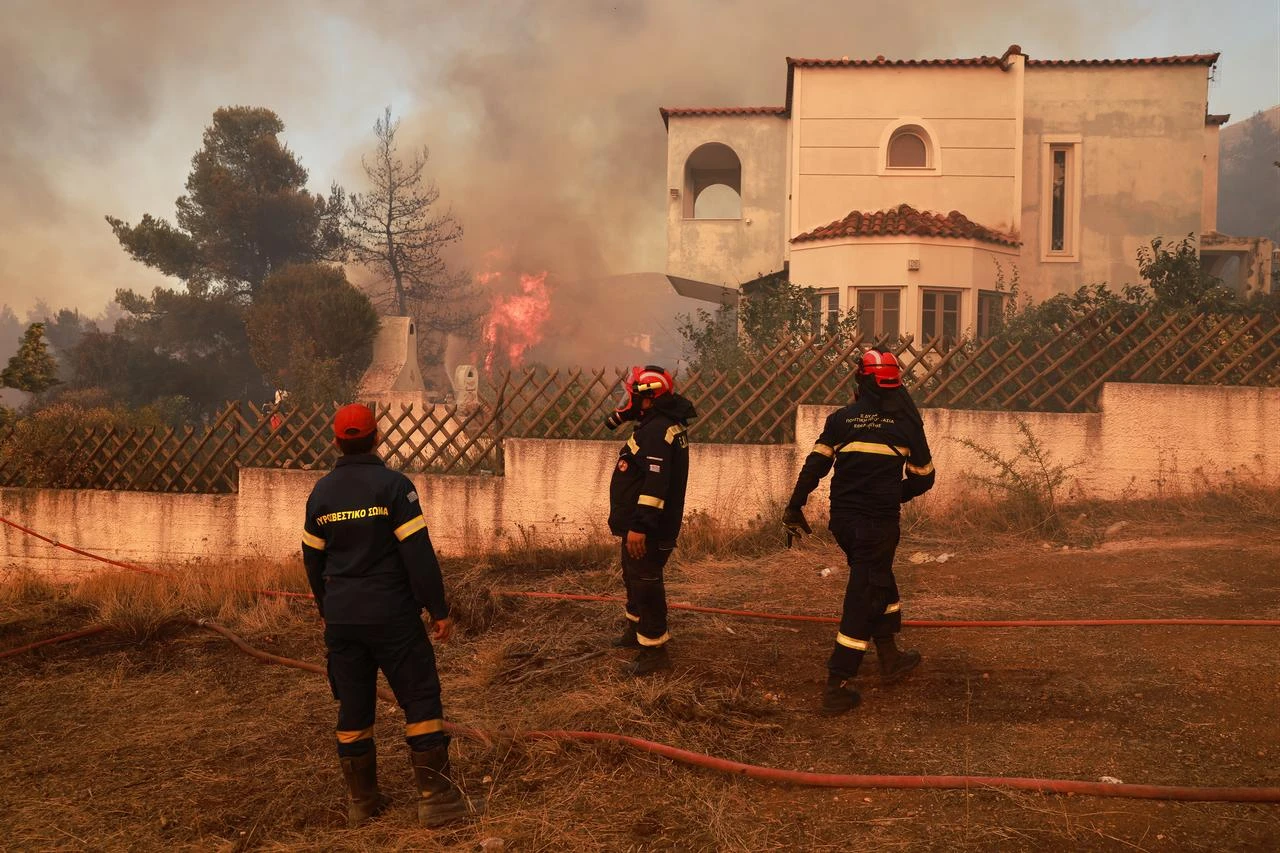 Firefighters battle a wildfire burning near Porto Germeno, 70 kilometres northwest of Athens in the region of Viotia, Greece, on August 2, 2026. (AA Photo)
