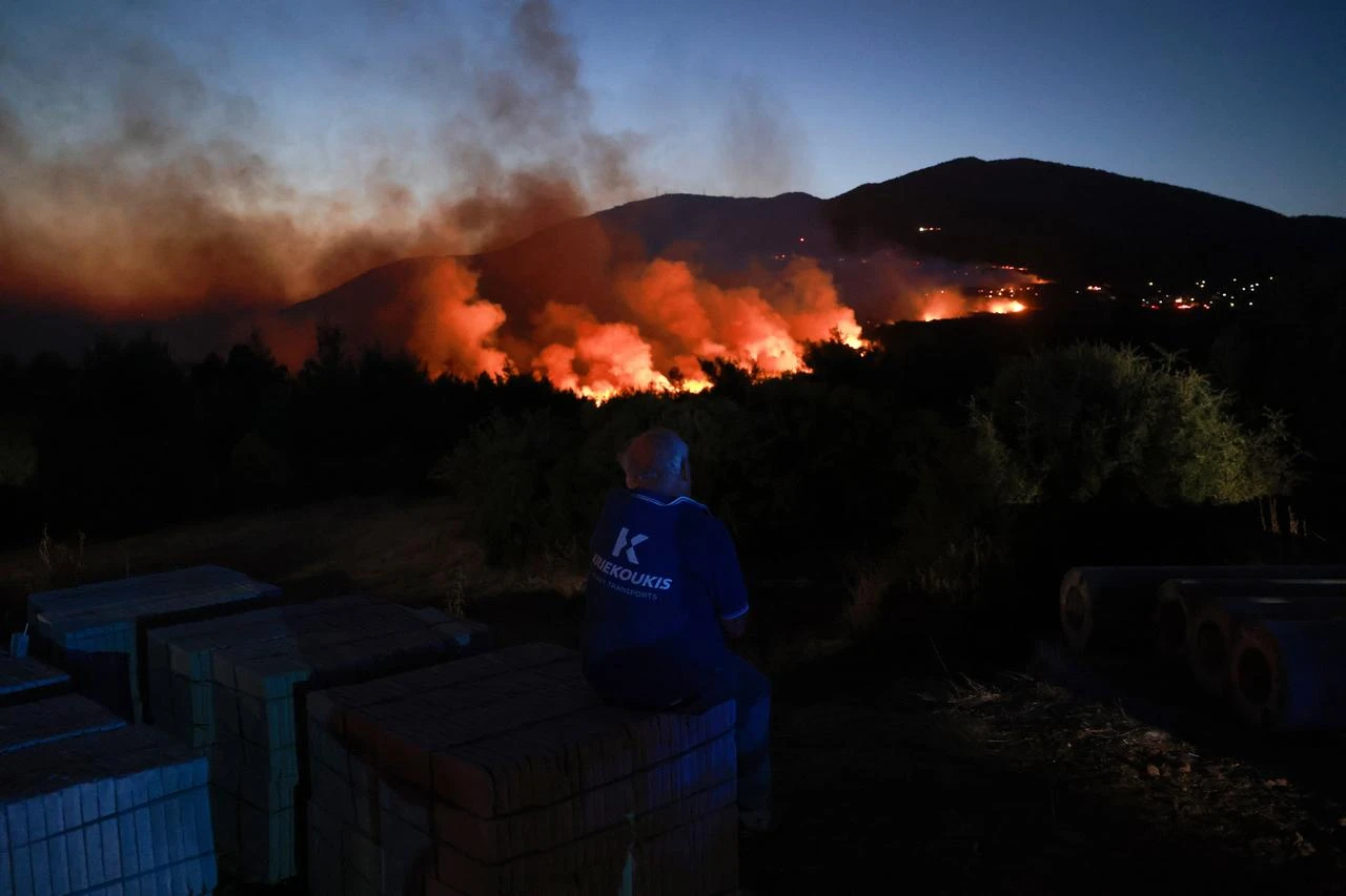 A wildfire burns near Porto Germeno, 70 kilometres northwest of Athens in the region of Viotia, Greece, on August 2, 2026. (AA Photo)