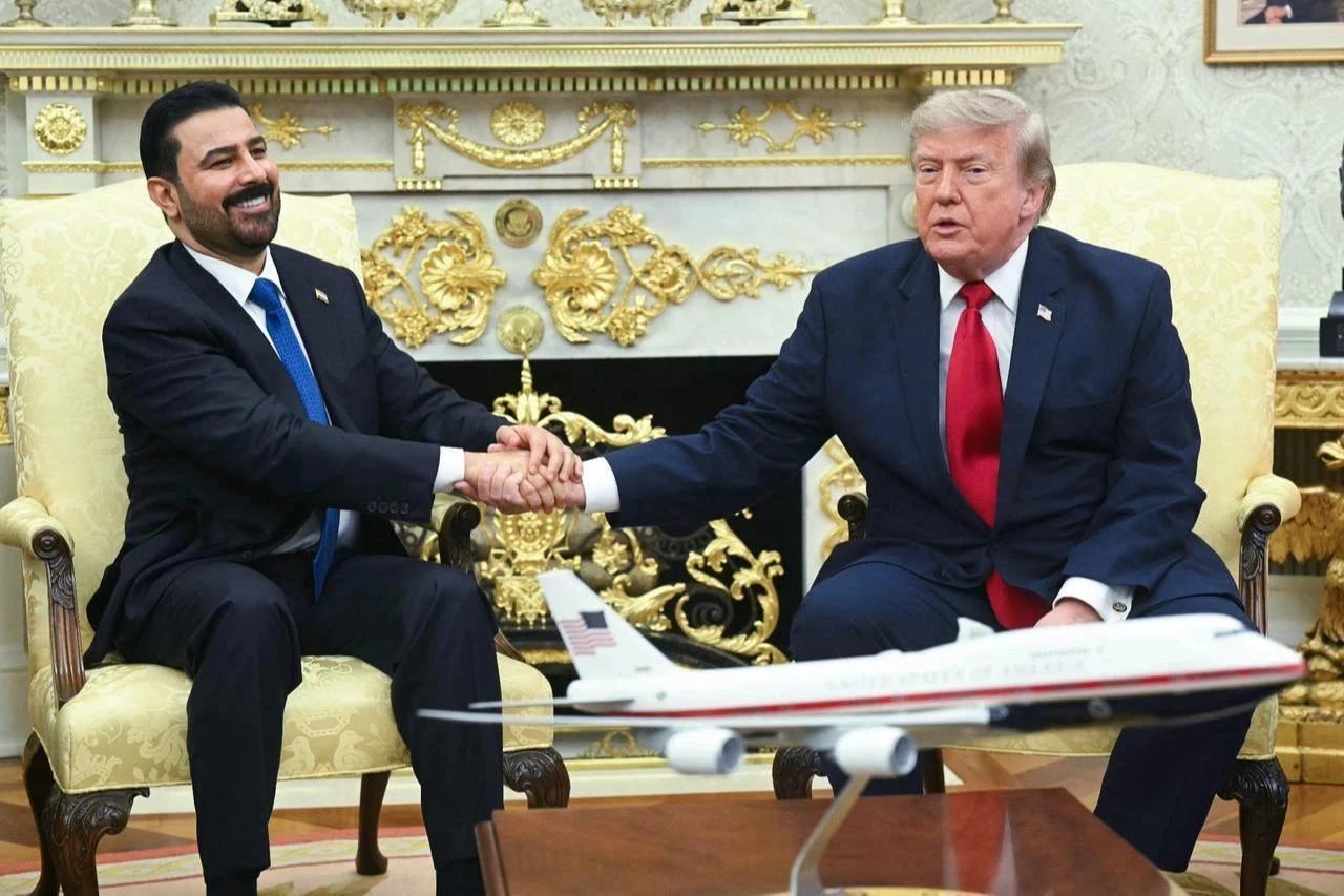 US President Donald Trump shakes hands with Prime Minister of Iraq Ali al-Zaidi (L) in the Oval Office of the White House in Washington, DC, on July 14, 2026. (AFP Photo)