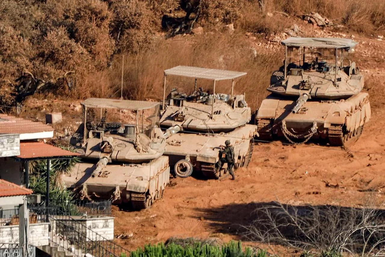 Israeli battle tanks deploy in the village of Zawtar al-Sharqiyah (Eastern Zawtar) in southern Lebanon as pictured from the nearby village of Zawtar al-Gharbiyah (Western Zawtar), August 2, 2026. (AFP Photo)