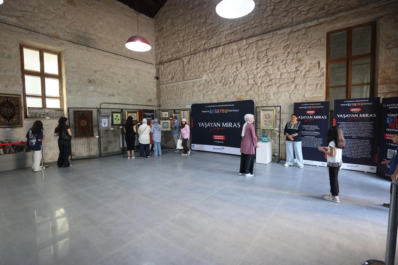 Visitors explore the “Living Heritage” exhibition at Cappadocia University’s Urgup Factory Campus during the Türkiye Culture Route Festival in Nevsehir, Türkiye. (AA Photo)