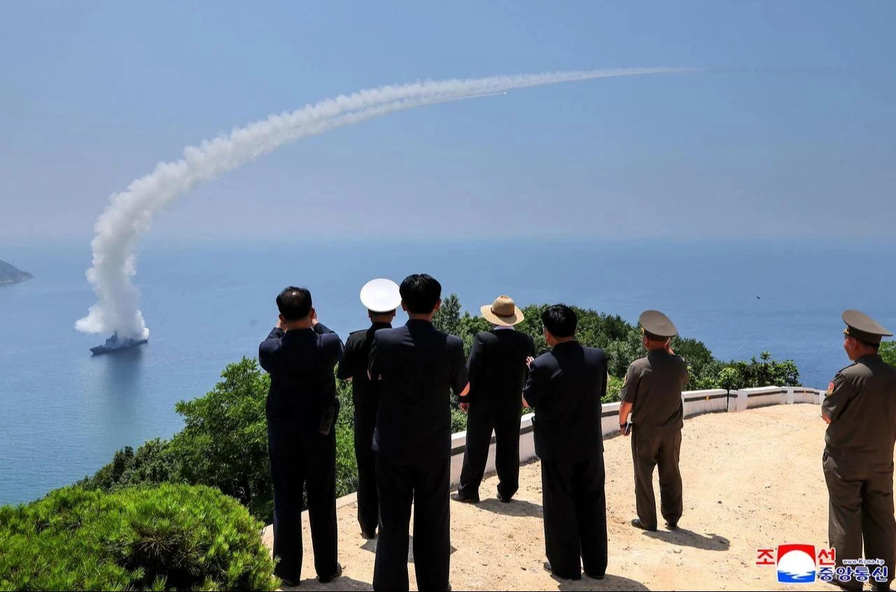 This picture taken on July 3, 2026 and released by North Korea's official Korean Central News Agency (KCNA) via KNS on July 5, 2026 shows North Korea's leader Kim Jong Un (C) observing performance tests of the main weapons systems of the destroyer Kang Kon at an undisclosed location in North Korea. (Photo by KCNA VIA KNS/AFP)