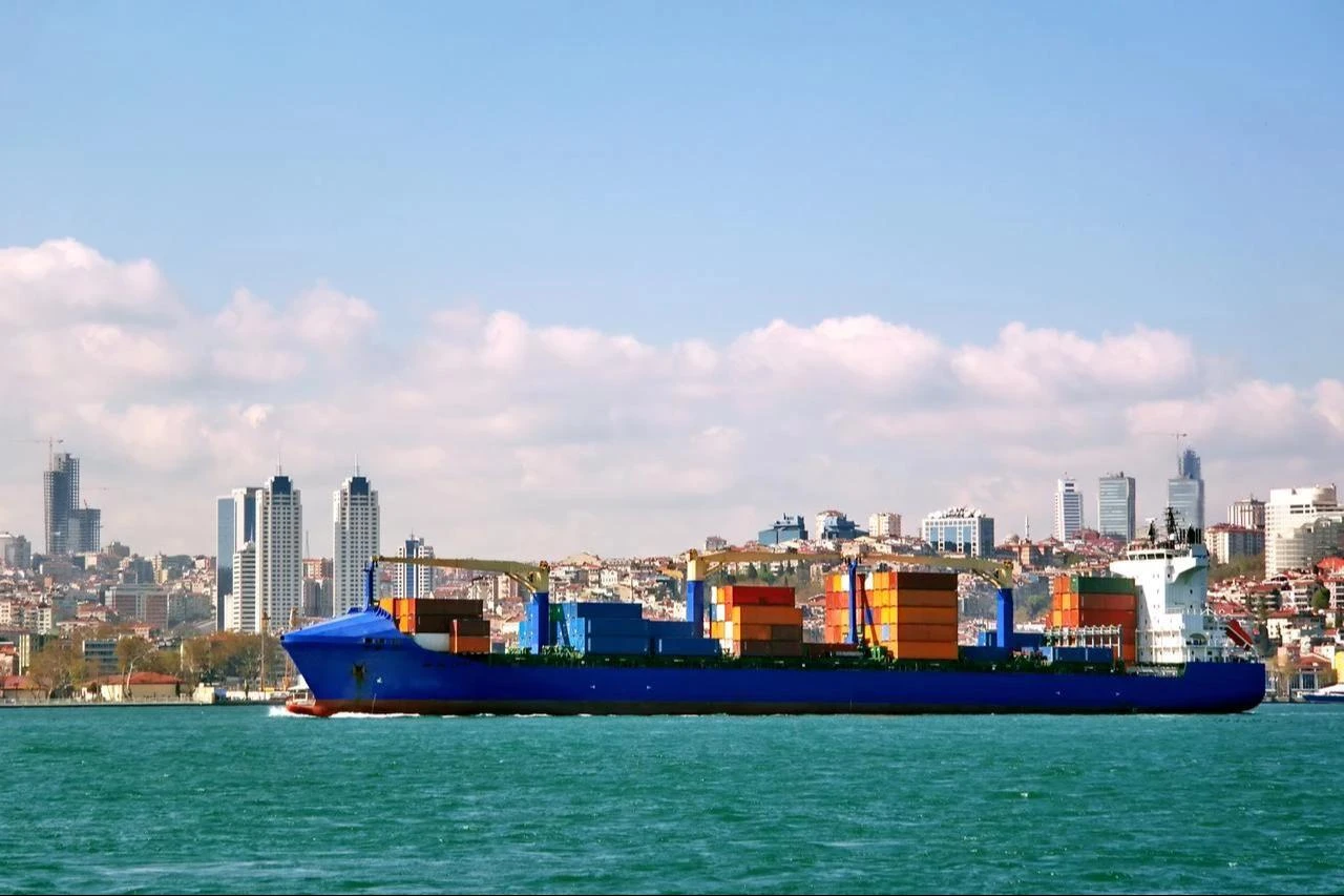 A container ship sails through the Bosporus past Istanbul, Türkiye. (Adobe Stock Photo)