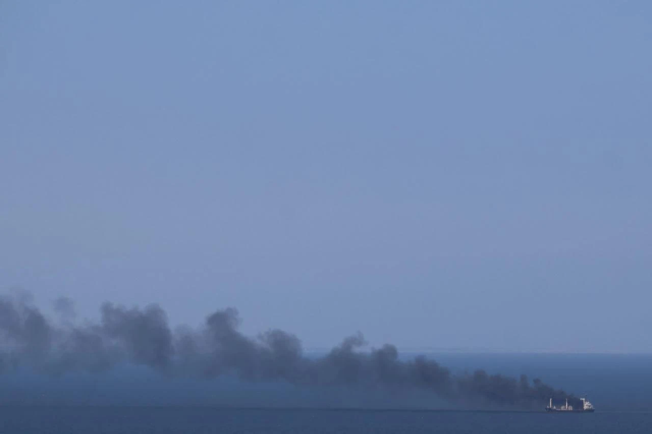 This photograph shows smoke rising from a civilian cargo ship Golden Leo following an alleged Russian missile strike, on the Black Sea near Odesa on July 19, 2026, amid the Russian invasion of Ukraine. (AFP Photo)