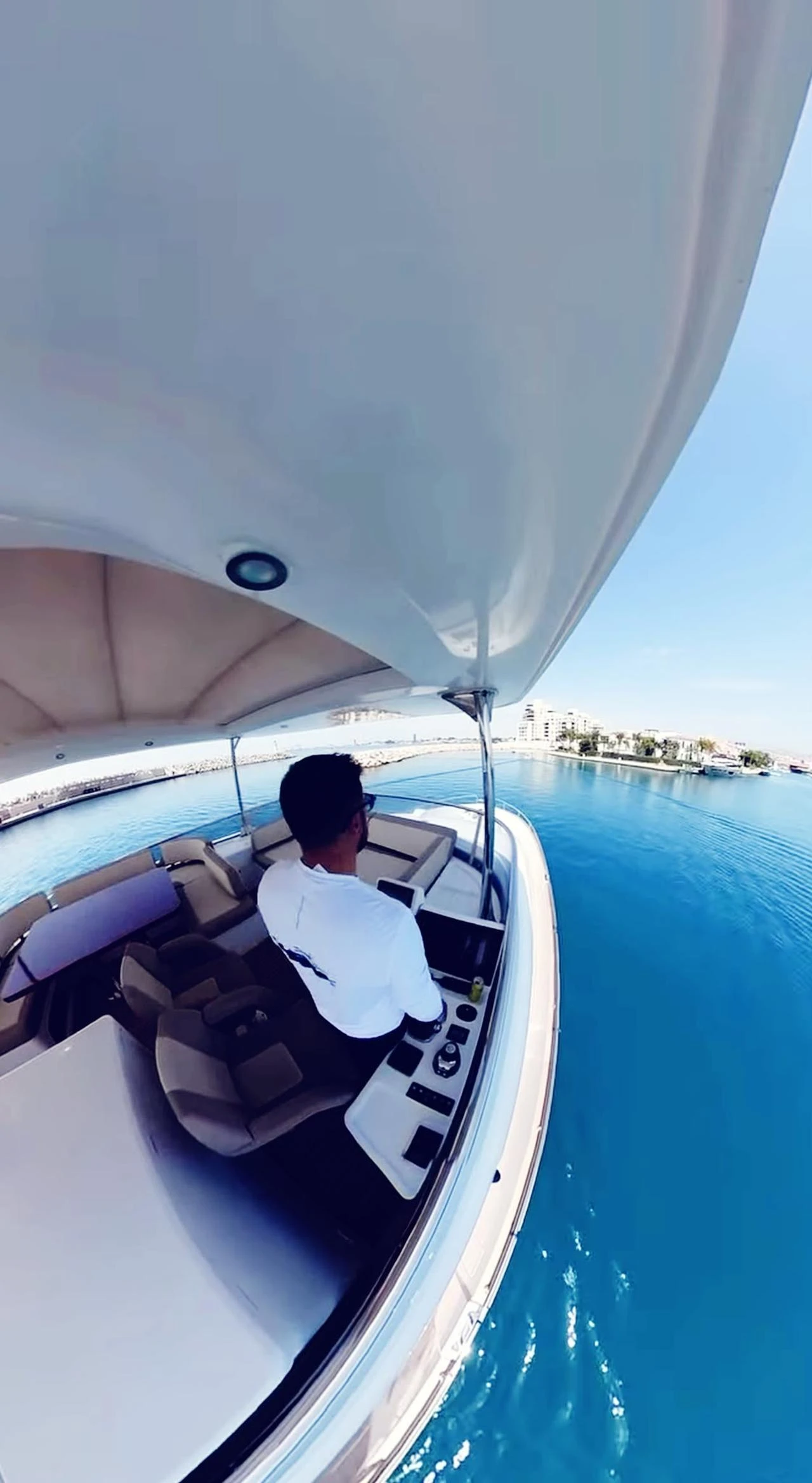 Ahmet Yilmaz aboard his boat in the Aegean Sea near Bodrum, where each summer voyage represents part of the income needed to carry him through the quieter months of the year. (Photo via Nour Dajani)
