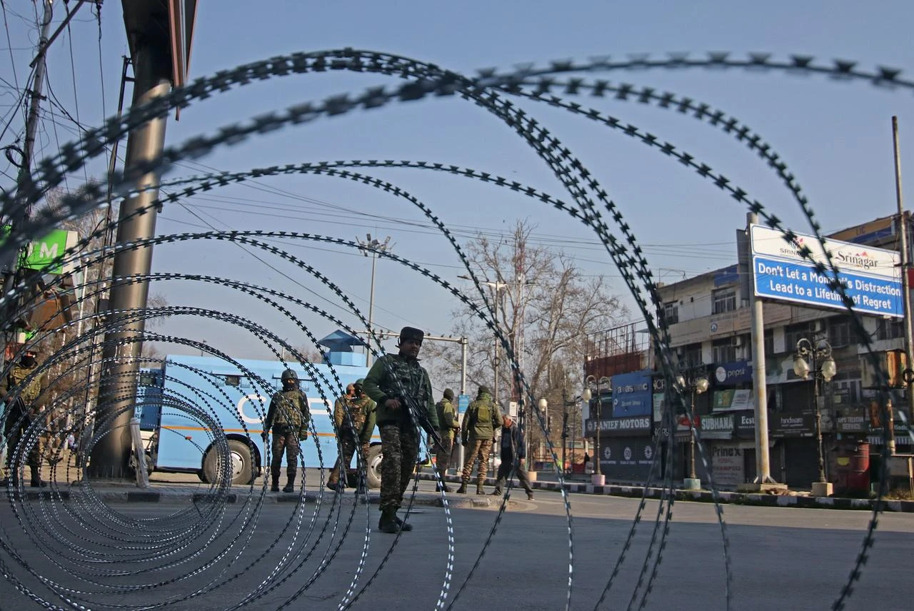 Indian paramilitary soldiers guard a street during restrictions in Srinagar, Kashmir India on March 03, 2026. (AA Photo)