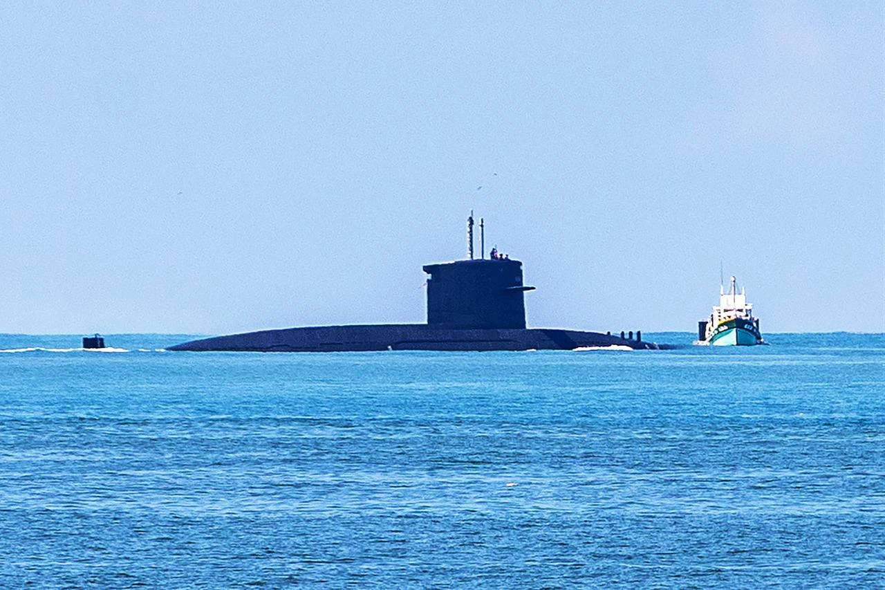 A Republic of China Navy Hai Lung-class submarine navigates the coastal waters accompanied by a support vessel during naval drills on the opening day of the Han Kuang military exercise in Kaohsiung, August 5, 2026. (AFP Photo)