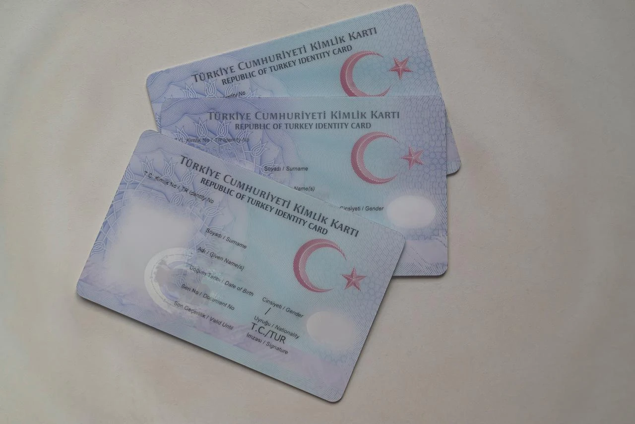 Turkish identity cards are displayed on a white surface. (Adobe Stock Photo)