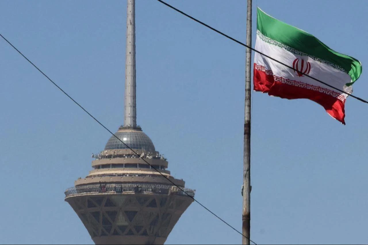 The Iranian flag flutters near the Milad Tower, part of the International Trade and Convention Center of Tehran, in the capital, May 25, 2026. (AFP Photo)