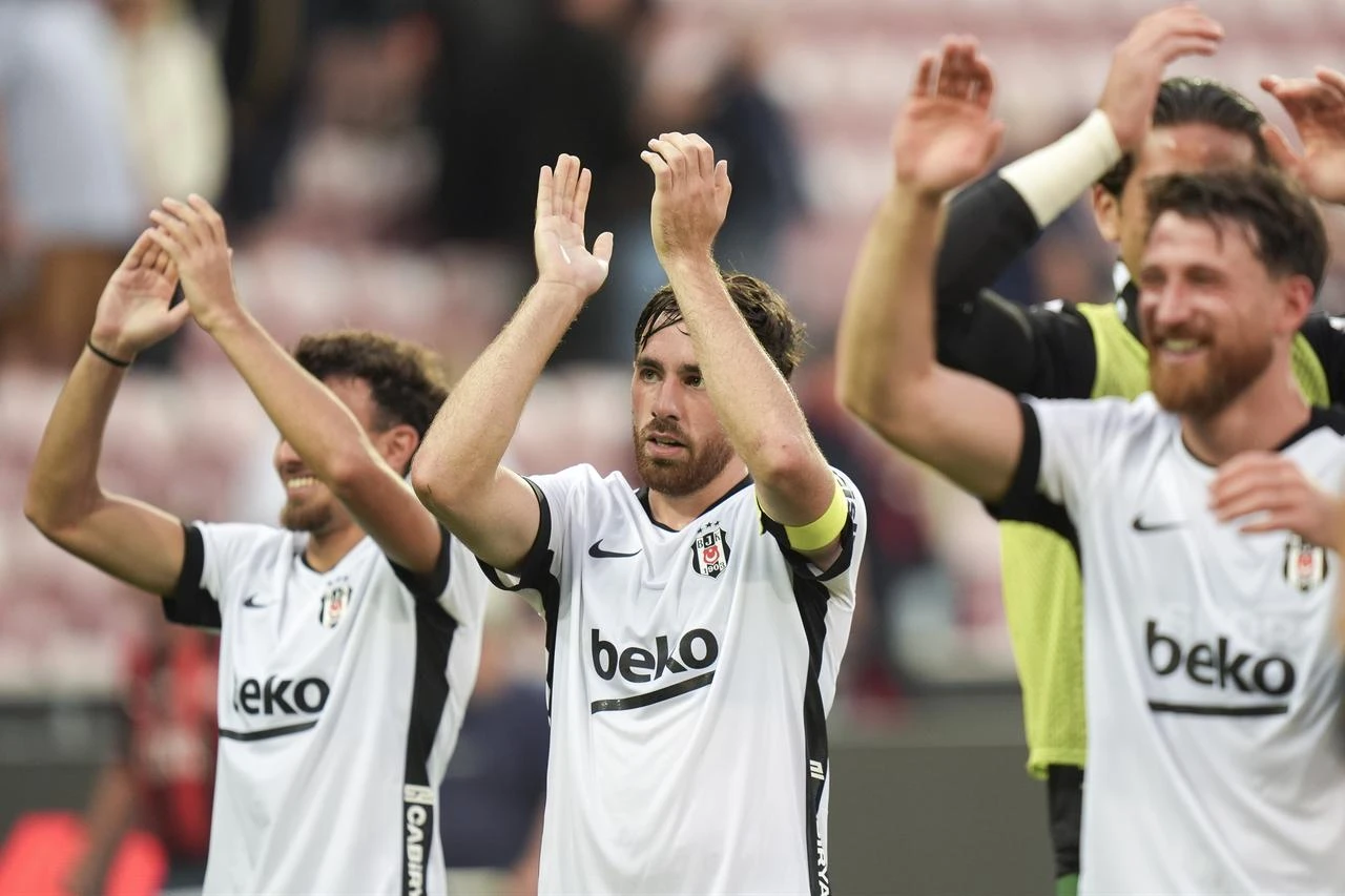 Orkun Kokcu of Besiktas celebrates with fans after victory in the UEFA Europa League second qualifying round second-leg match between Midtjylland and Besiktas at MCH Arena in Herning, Denmark, on July 30, 2026. (AA Photo)