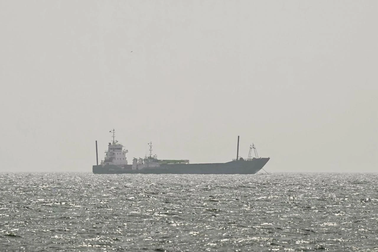 A vessel is anchored off the coast of Sharjah in the United Arab Emirates on August 3, 2026. (AFP Photo)