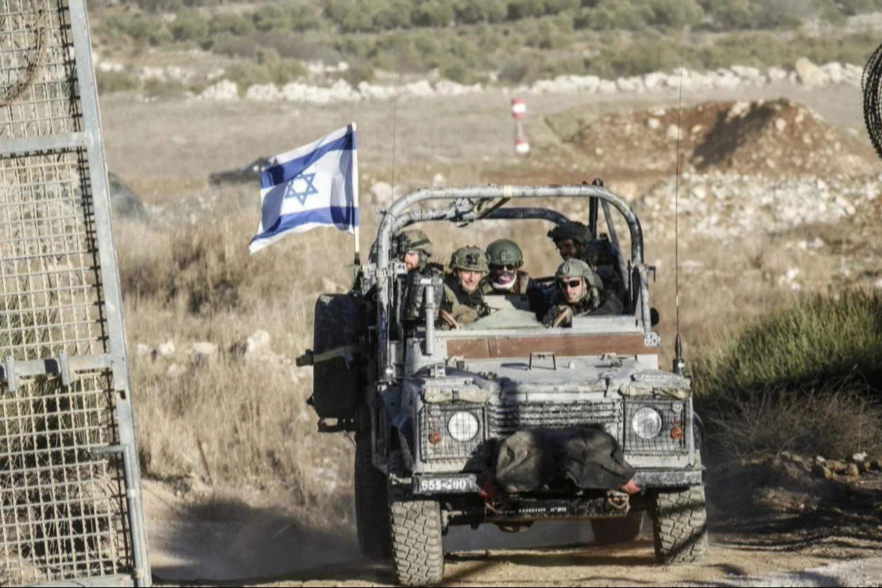 A view of Israeli military vehicles patrolling the Syrian-Israeli border in the Majdal Shams area of the Golan Heights, as the Israeli army reinforces its ground forces amid ongoing military mobilization in the region, Dec. 15, 2024. (AA Photo)