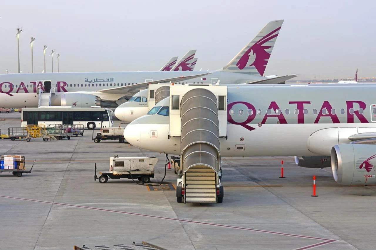 Qatar Airways aircraft are parked at gates at Hamad International Airport in Doha, Qatar, June 17, 2019. (Adobe Stock Photo)
