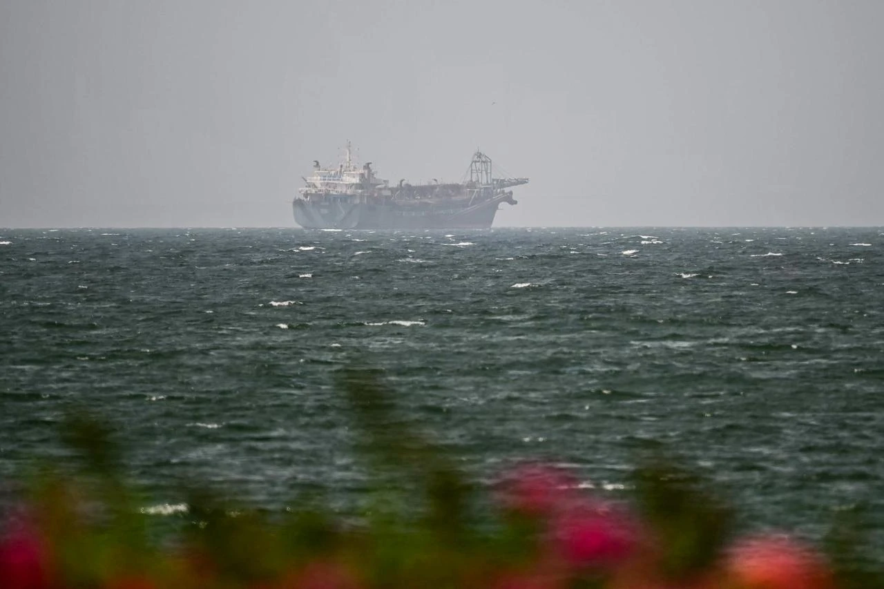 A vessel is seen off the coast of Sharjah in the United Arab Emirates on August 3, 2026. (AFP Photo)