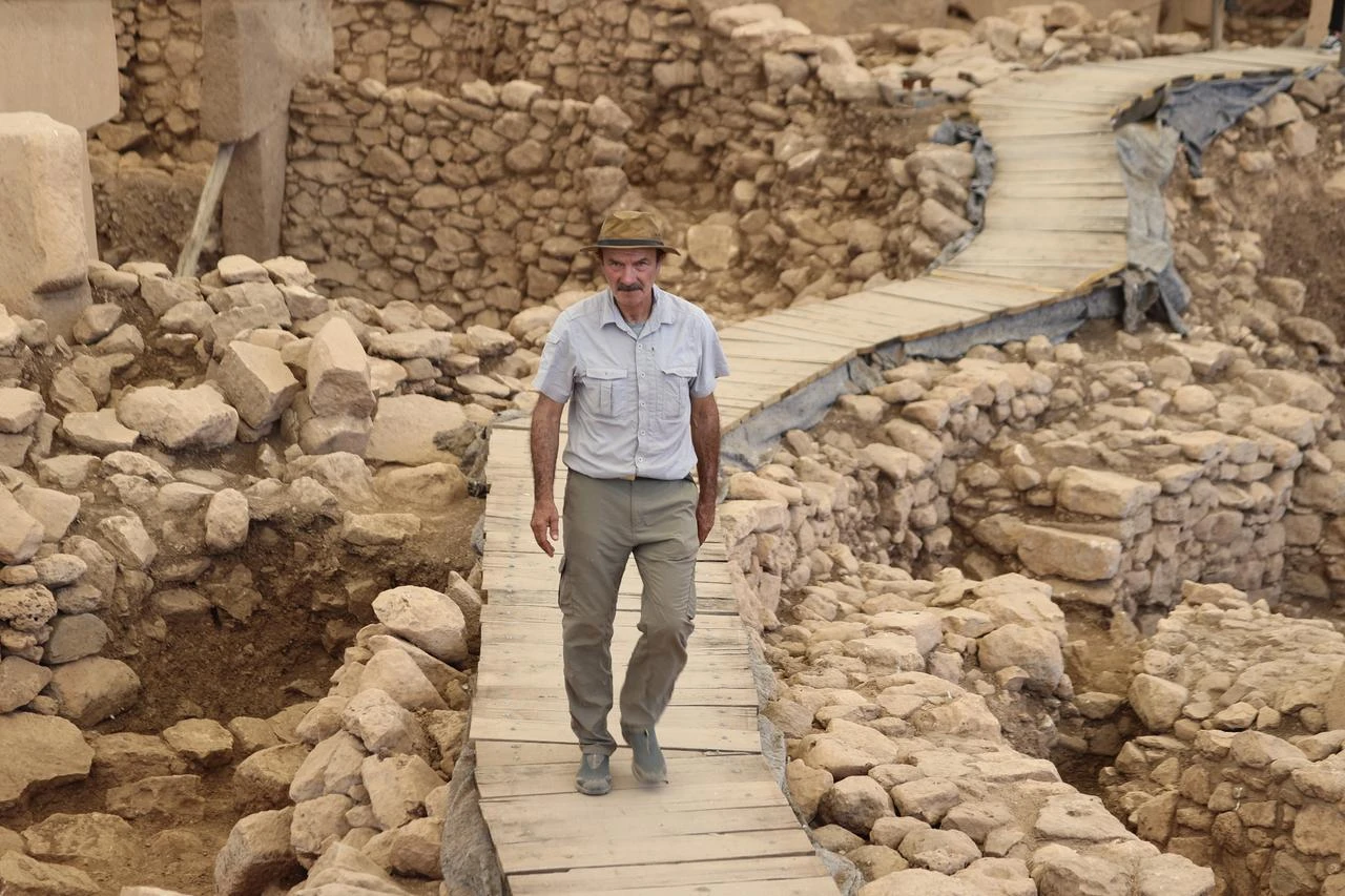 Professor Necmi Karul walks through the excavated Neolithic structures at the Göbeklitepe archaeological site in Sanliurfa, southeastern Türkiye. (AA Photo)