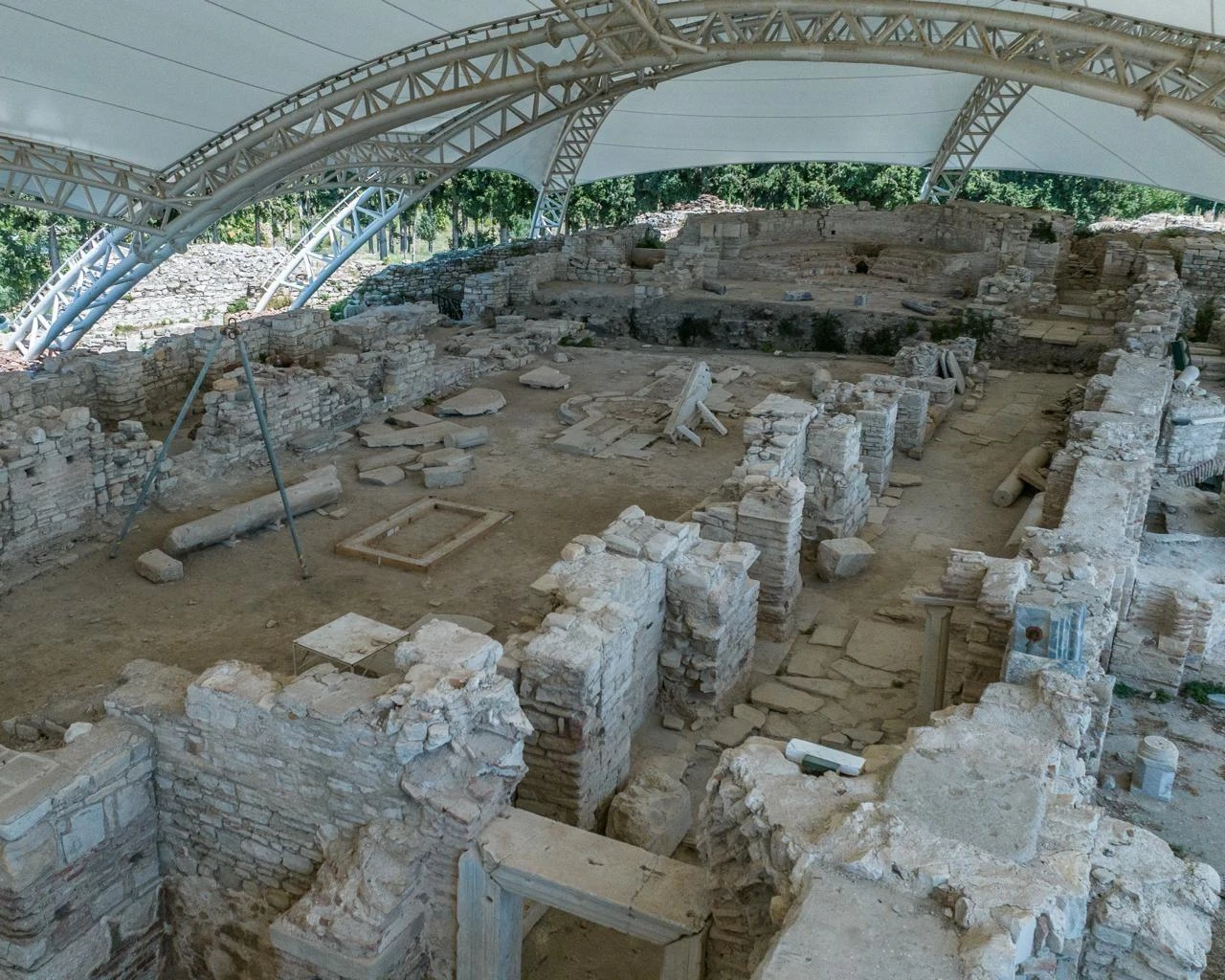 Stone walls, columns and architectural fragments uncovered during excavations at Kadikalesi, also known as Anaia, in Kusadasi. (IHA Photo)
