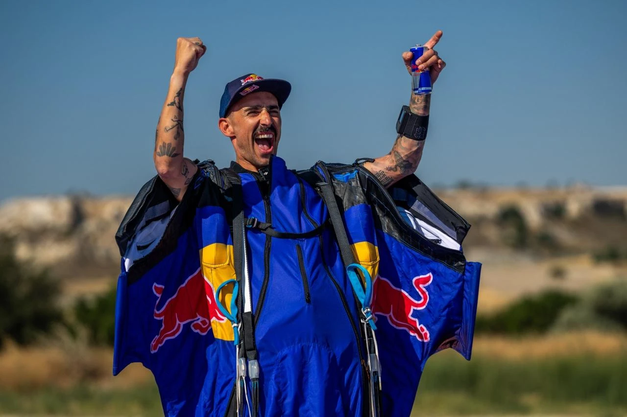 Austrian wingsuit athlete Marco Waltenspiel celebrates after completing his flight over Cappadocia in central Türkiye. (AA Photo)