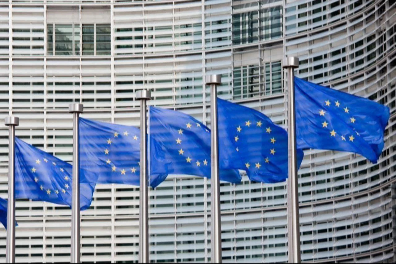 A line of EU flags stand in front of the European Commission building in Brussels, Belgium, accessed on November 3, 2025. (Adobe Stock Photo)