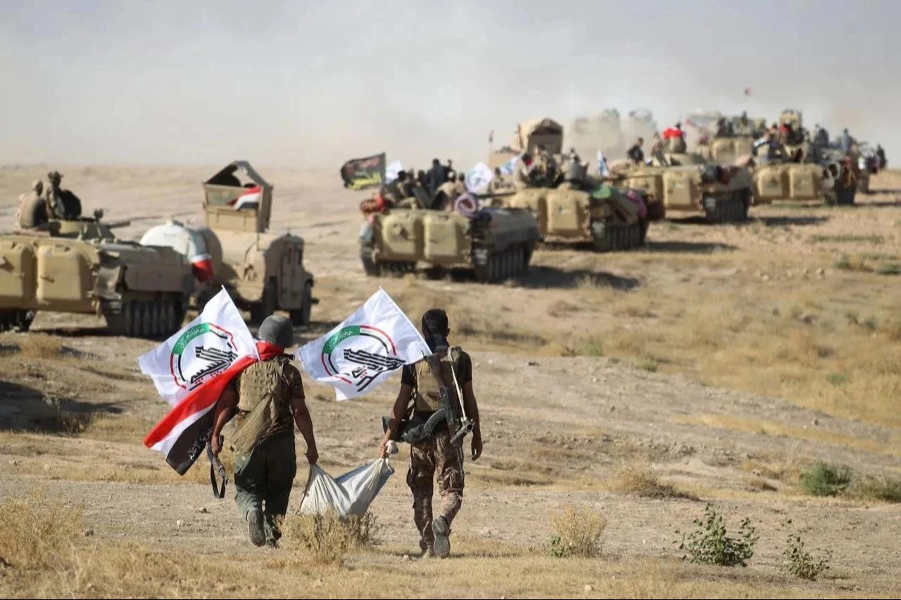 Members of the Popular Mobilization Forces advance toward Tal Afar, Iraq, Aug. 22, 2017. (AFP Photo)
