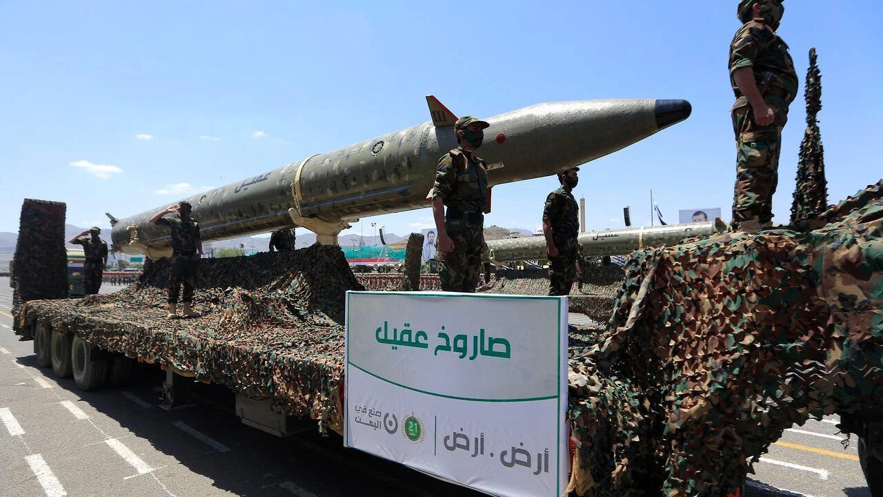 Houthis stand guard on a missile carrier during an official military parade marking the ninth anniversary of the Houthi takeover of the capital, Sanaa, Sept. 21, 2023. (AFP Photo)