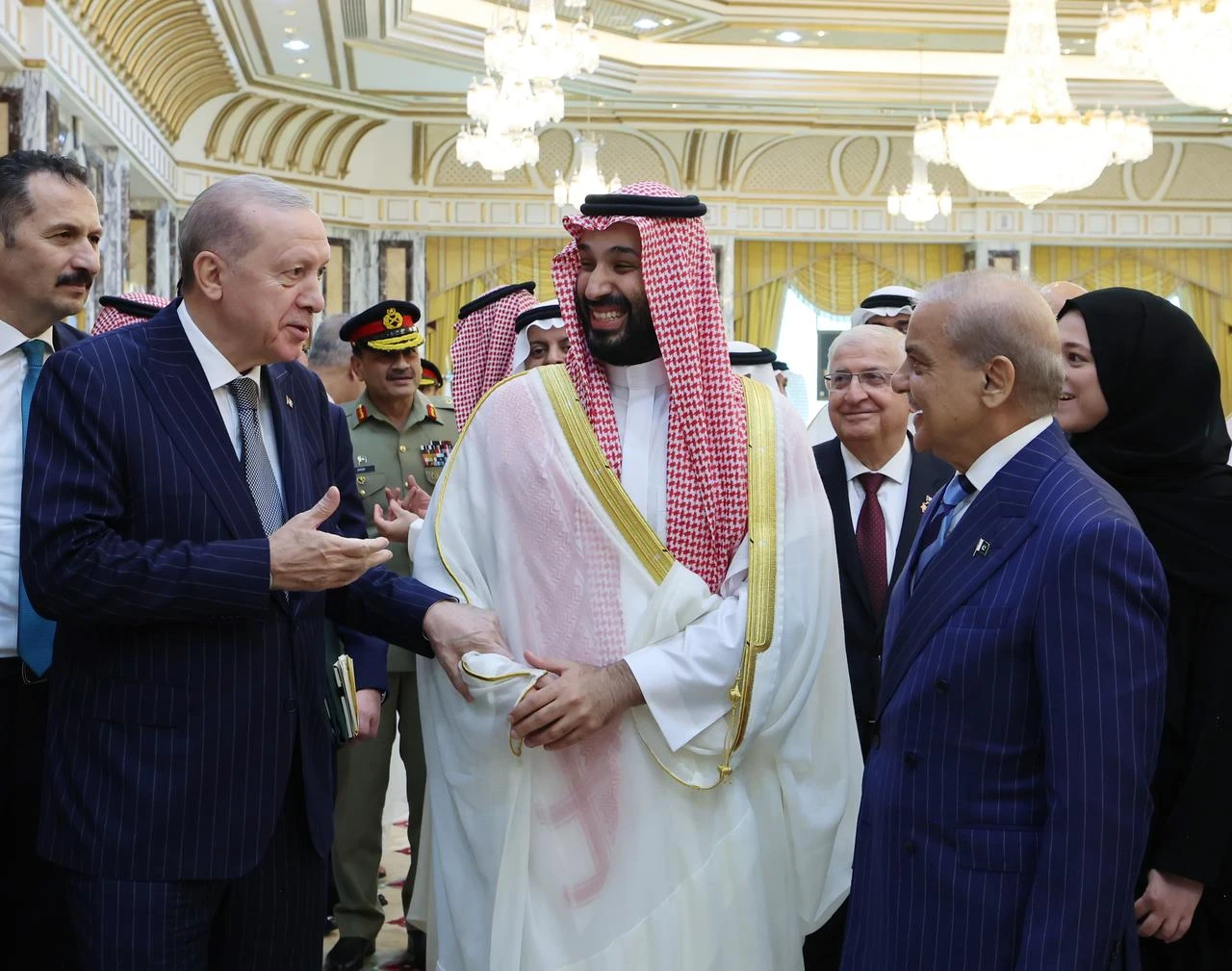 President Recep Tayyip Erdogan (L), Saudi Crown Prince Mohammed bin Salman (C) and Pakistani Prime Minister Shehbaz Sharif (R) sign a trilateral joint defense agreement in Mecca, Saudi Arabia, Aug. 7, 2026. (Photo via Turkish Presidency/Murat Cetinmuhurdar/HO)