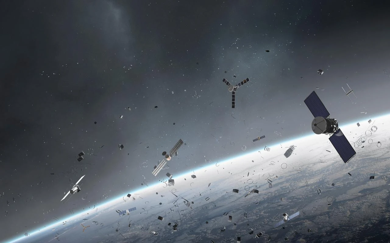 Cluster of space debris, junk, and satellites surrounding planet Earth. (Photo via Adobe Stock)
