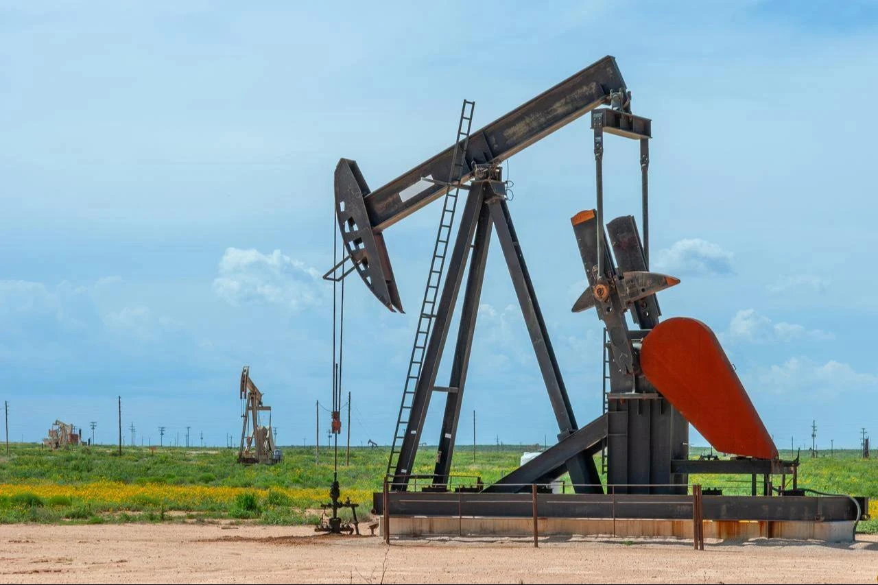 An oil pumpjack operates in a field in the United States, date and time undisclosed. (Adobe Stock Photo)
