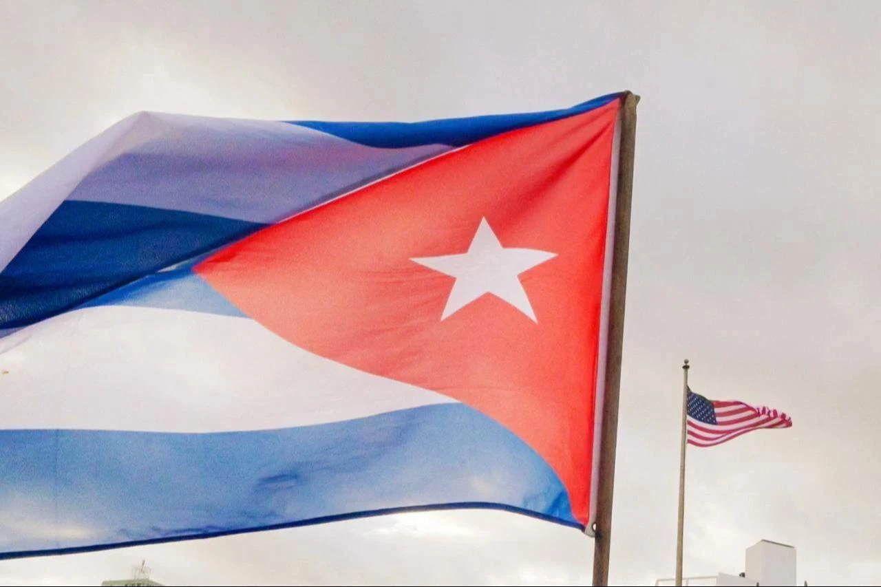 A Cuban soldier waves a national flag as he takes part in the "Anti-Imperialist" protest in front of the US Embassy against the US incursion in Venezuela, where 32 Cuban soldiers lost their lives, in Havana, Cuba, January 16, 2026. (AFP Photo)