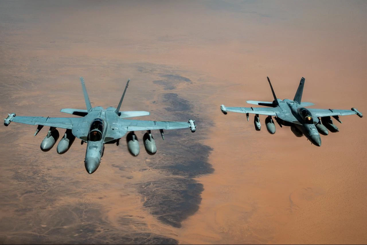 U.S. Navy F/A-18 Super Hornet fly side by side in the U.S. Central Command area of responsibility Aug. 3, 2026. (Photo via U.S. Air Force)