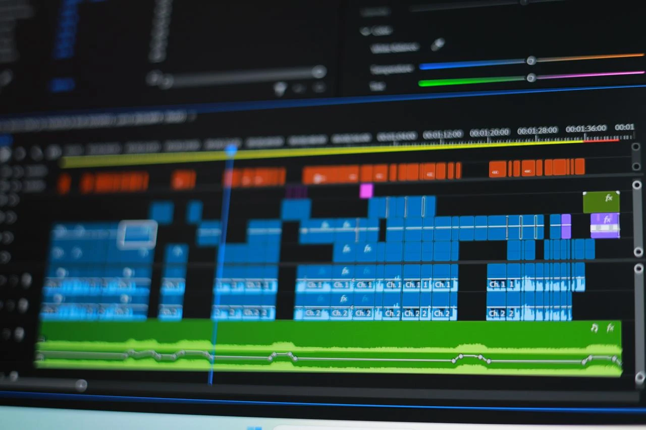 Video editing software displays a multitrack production timeline on a computer screen. (Adobe Stock Photo)