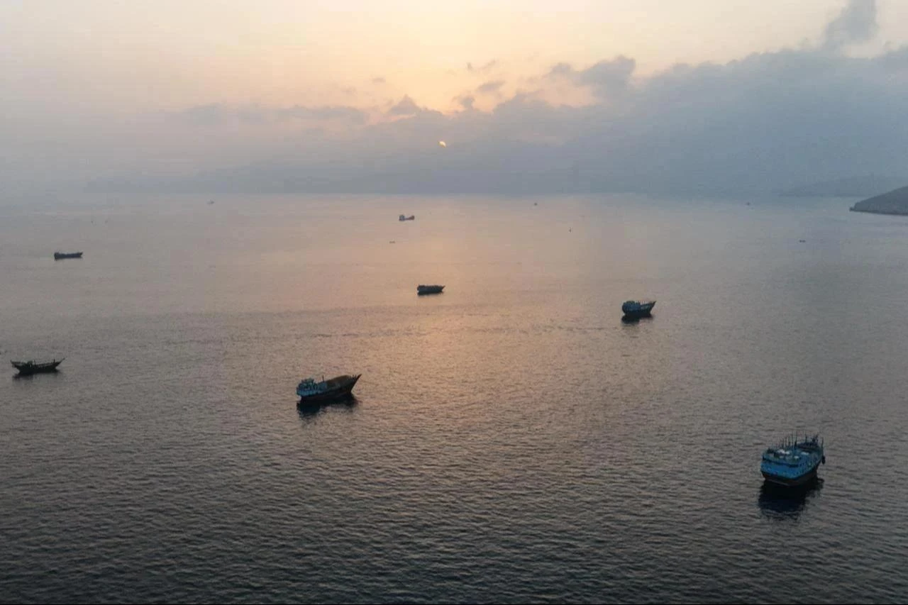 This aerial photograph shows boats anchored off Oman’s northern Musandam Peninsula near the Strait of Hormuz, June 27, 2026. (AFP Photo)