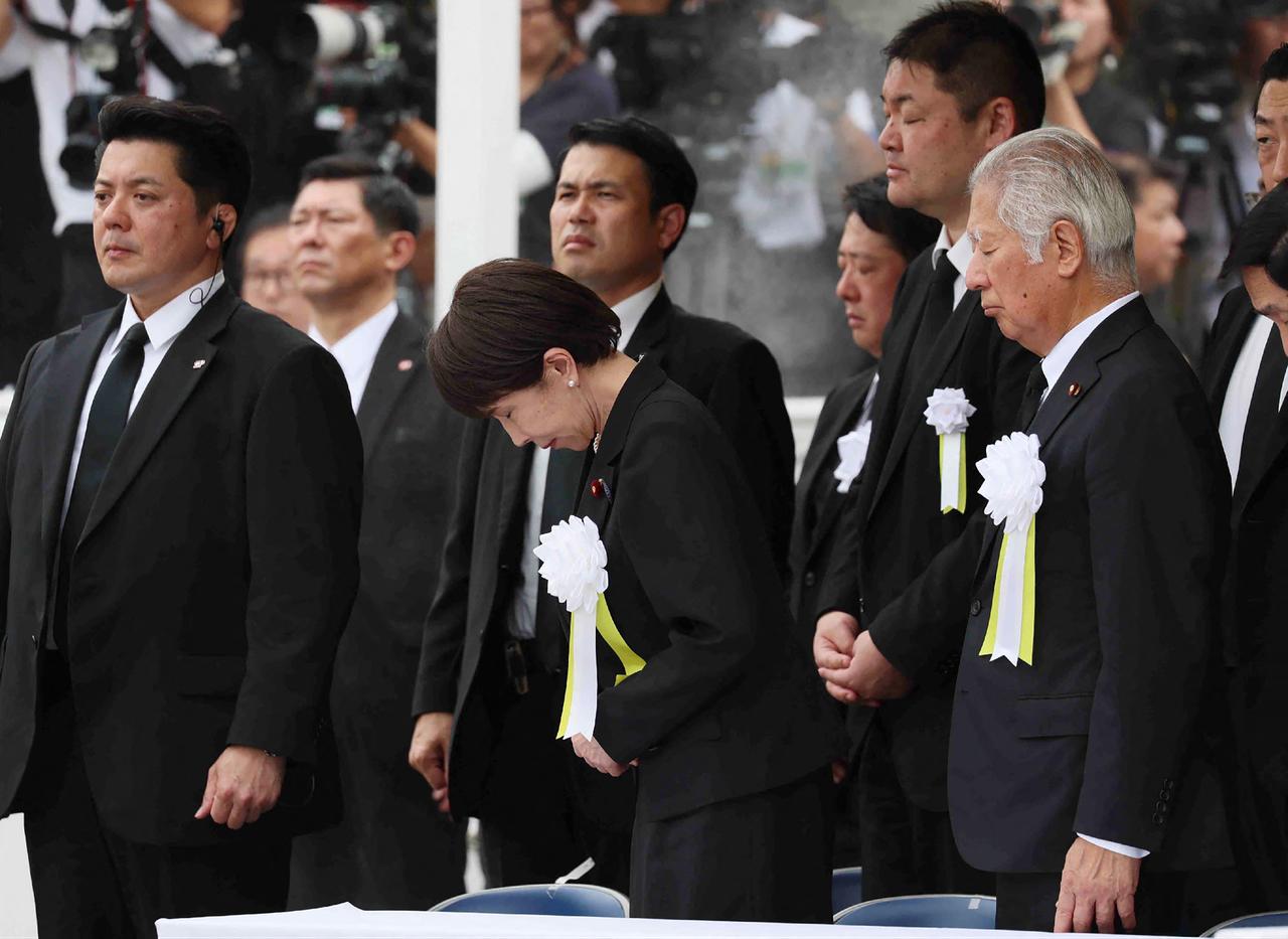 Japanese Prime Minister Sanae Takaichi (C) bows during a ceremony at the Peace Memorial in Nagasaki on August 9, 2026, marking the 81st anniversary of the atomic bombing. (AFP Photo)