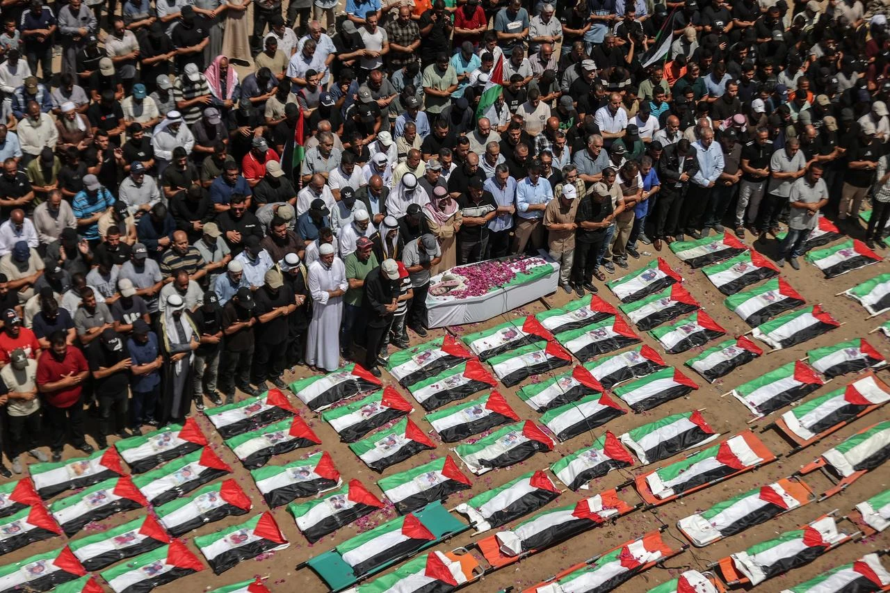 An aerial view of Palestinians performing funeral prayers during a mass funeral ceremony in Gaza City, Palestine, on August 4, 2026. (AA Photo)