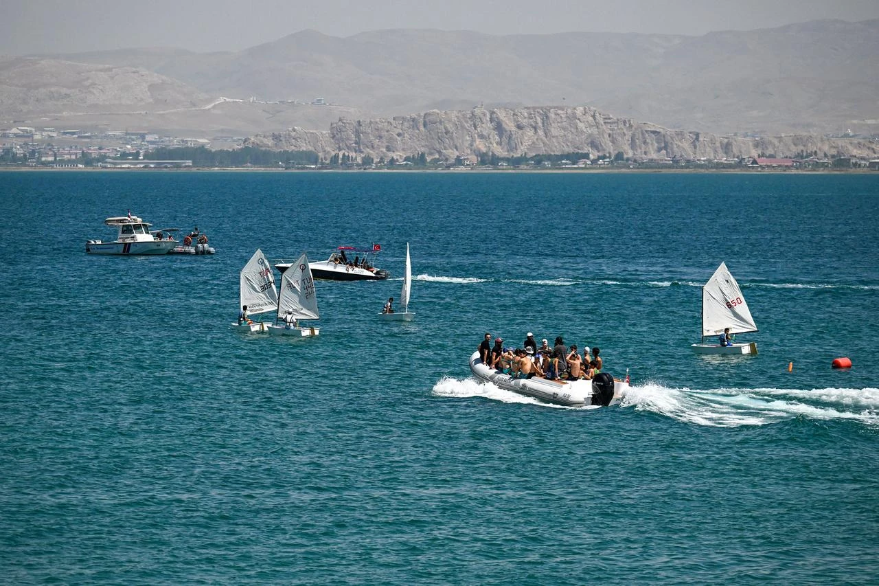 Sailboats and support vessels take part in the 12th Lake Van Water Sports Festival on Lake Van in eastern Türkiye, Aug. 8, 2026. (AA Photo)