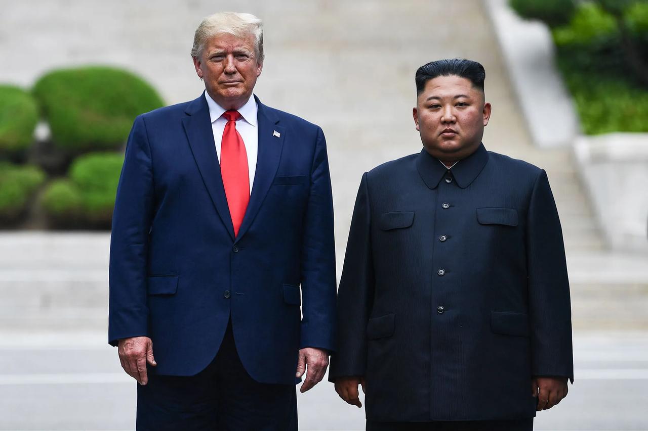 US President Donald Trump and North Korean leader Kim Jong Un during their summit on the border separating the Koreas on June 30, 2019. (AFP Photo)